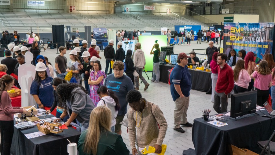 Students visiting employer booths at the Spring Forward Career Expo